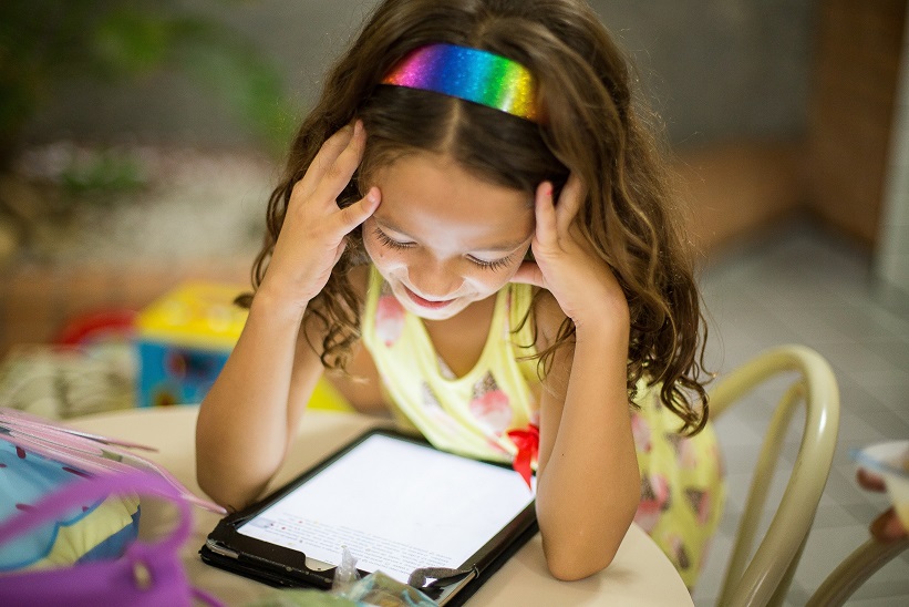 Girl looking at a tablet